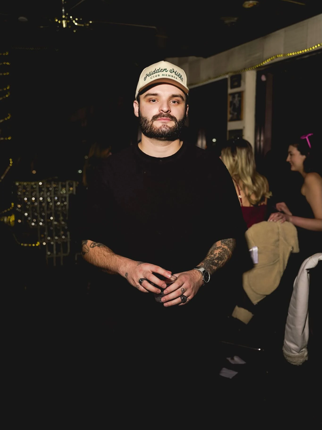 Patrick Walsh looking directly at the camera at a nightlife event